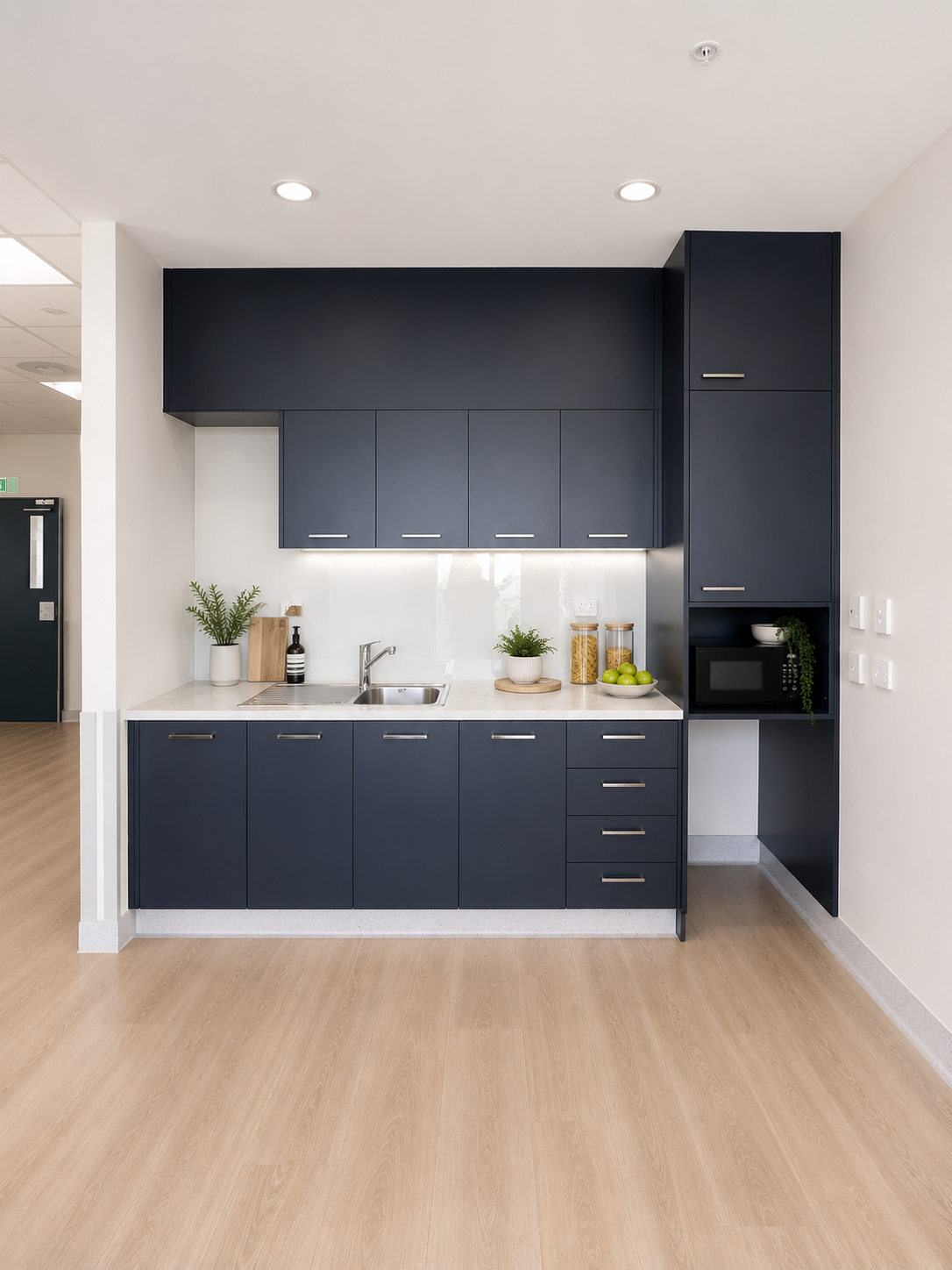 modern minimalist kitchenette with natural accents